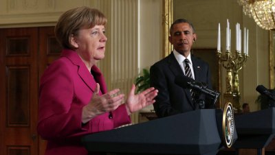 Обама и Меркель договорились оставить в силе санкции против России